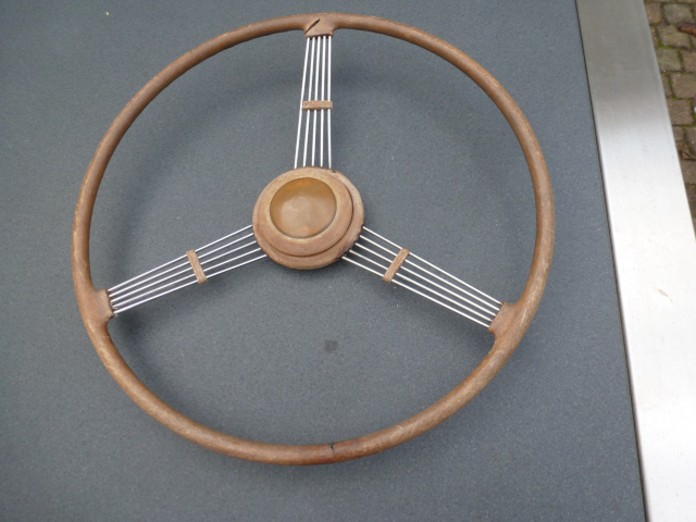 The steering wheel as received. The original topcoat completely disappeared