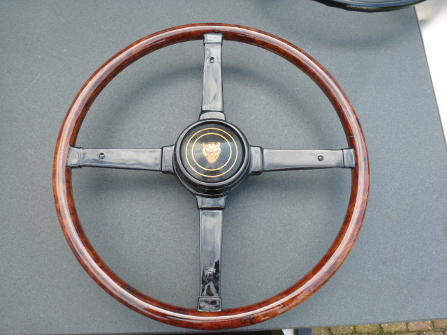 Restored steering wheel with Burl walnut wood rim, standard horn button and all plastic replaced by epoxy