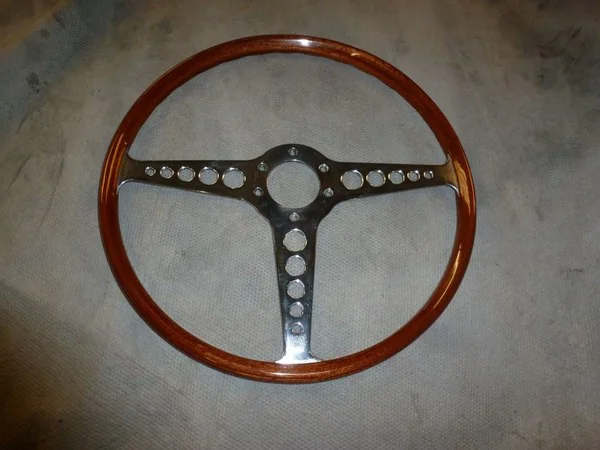 Jaguar E-Type restored steering wheel made using circular mahogany wrapping method