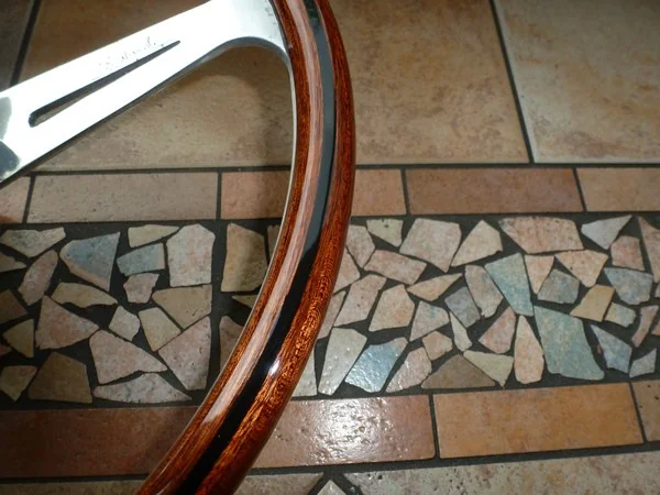 Lancia Flaminia Nardi steering wheel detail showing mahogany wood grain