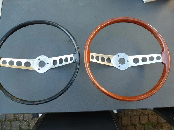 Volvo P1800 original steering wheel compared to custom wooden rim conversion